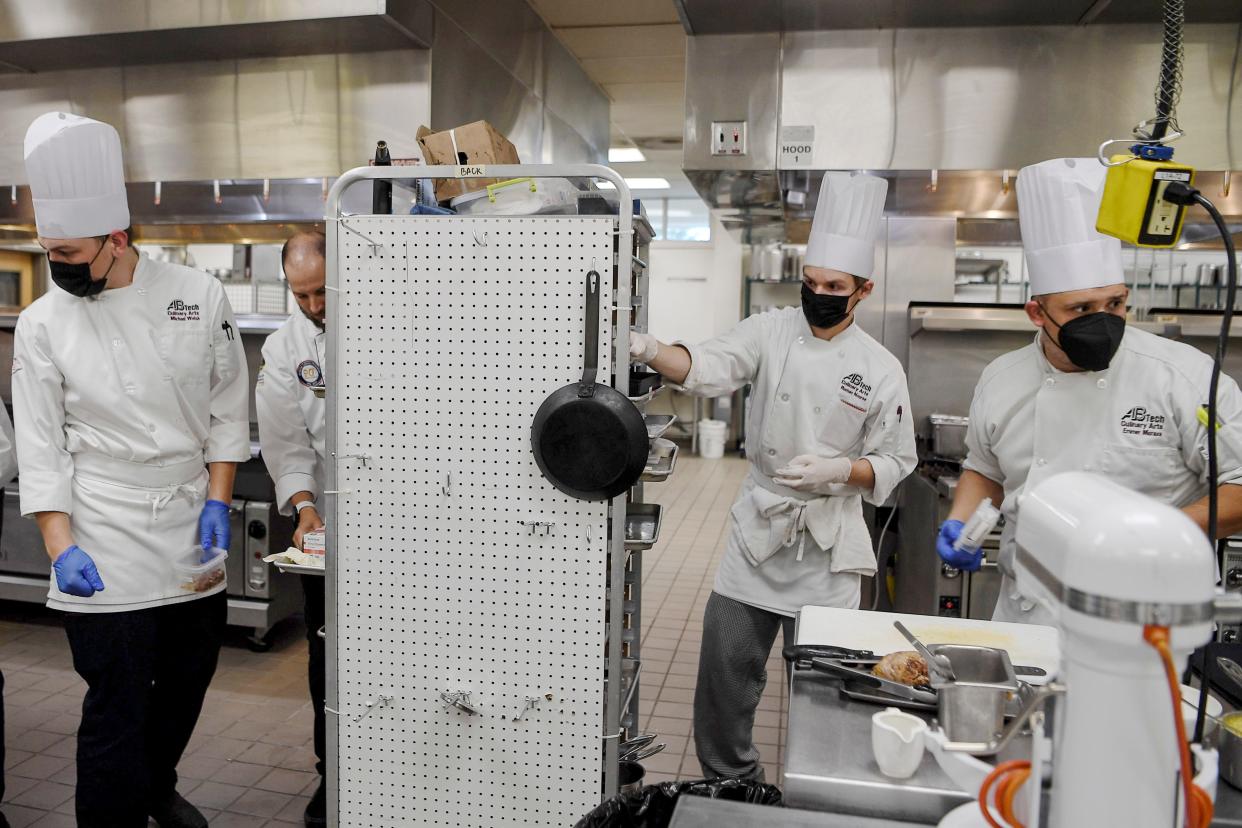 From left, Michael Welsh, Roman Nourse and Emmer Moraza rehearse a three-course meal at AB-Tech July 20, 2021 for the upcoming National American Culinary Federation competition.