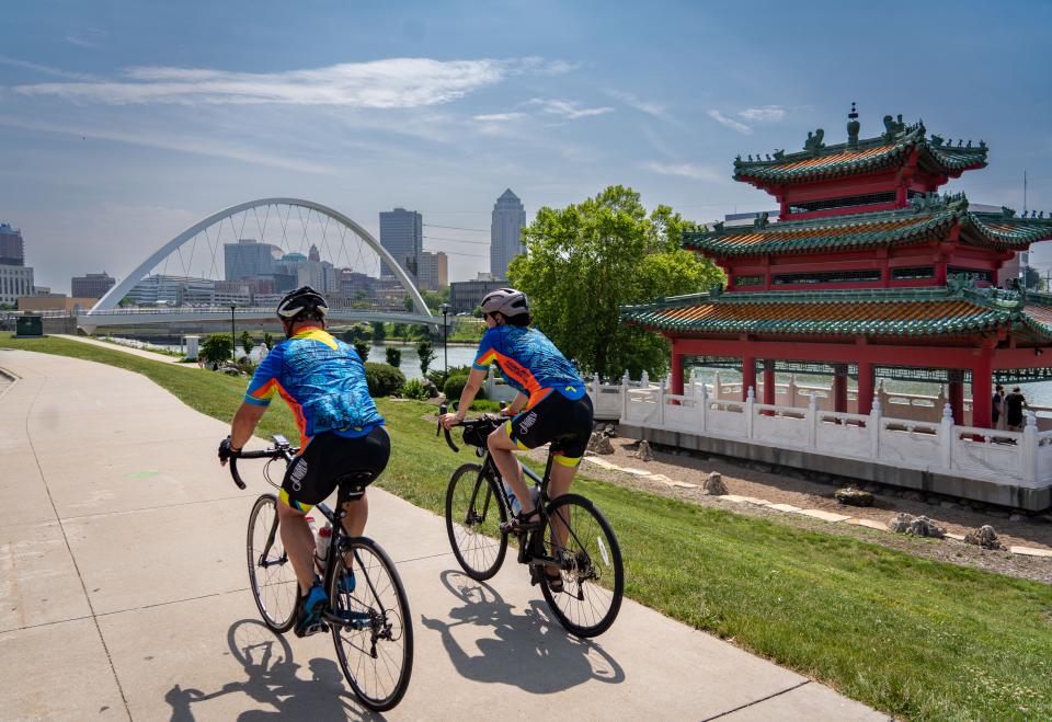 Riders roll into Des Moines during the RAGBRAI route inspection ride in June.