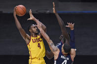 Southern California's Evan Mobley shoots over Connecticut's Tyrese Martin, front, and Adama Sanogo during the second half of an NCAA college basketball game Thursday, Dec. 3, 2020, in Uncasville, Conn. (AP Photo/Jessica Hill)