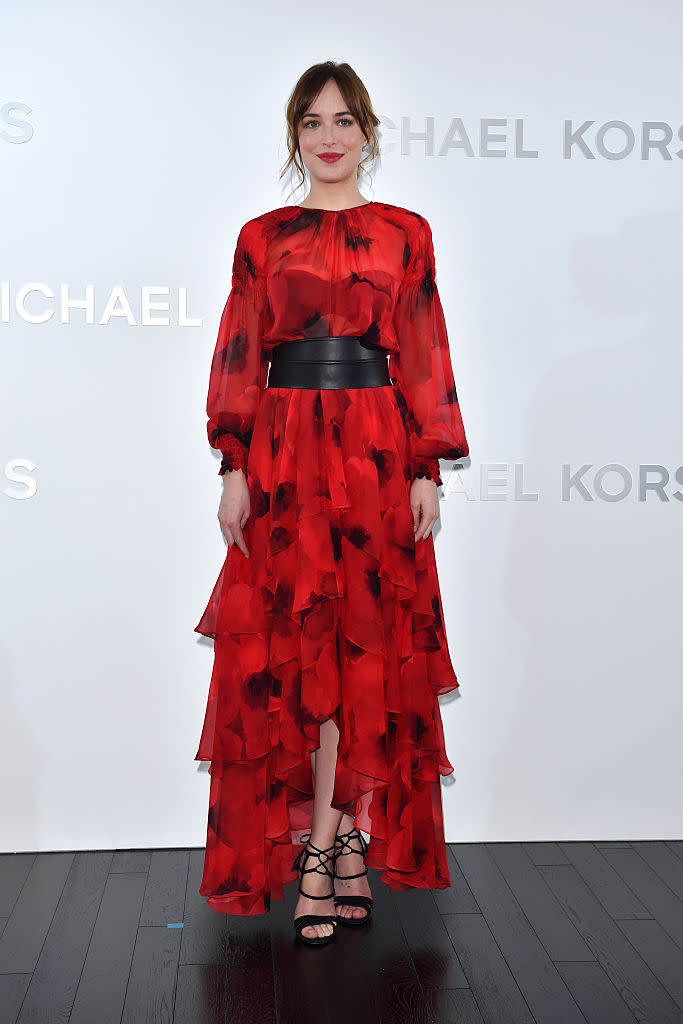 <p>Ruffles! Dakota steals the show in this stunning red frock in Tokyo, Japan. <i>(Getty)</i> </p>