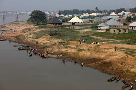 People are seen by the bank of River Benue in Makurdi, Nigeria November 29, 2018. Picture taken November 29, 2018. REUTERS/Afolabi Sotunde