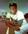 FILE - In this 1952 file photo, Brooklyn Dodgers baseball player Jackie Robinson poses. Baseball holds tributes across the country on Jackie Robinson Day, Tuesday, April 15, 2014, the 67th anniversary marking the end of the game's racial barrier. (AP Photo/File)