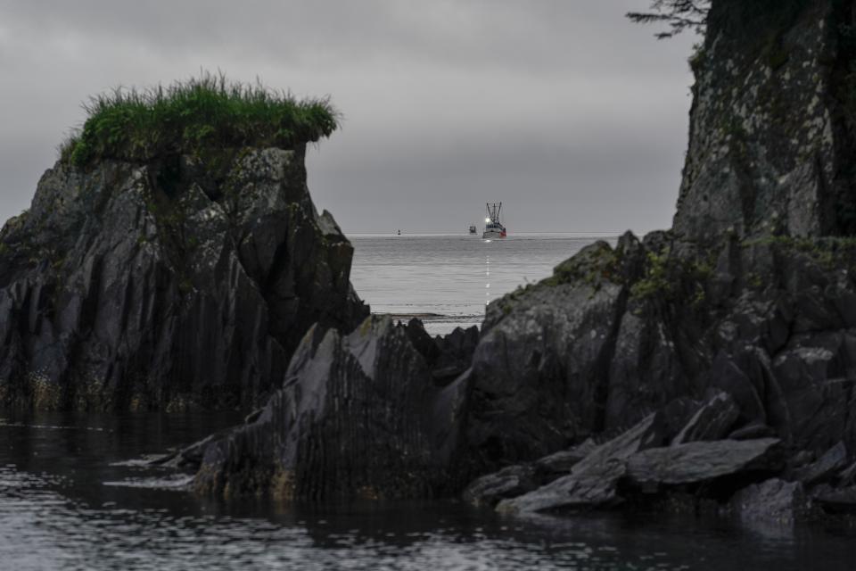 A fishing boat comes back to port, Saturday, June 24, 2023, in Kodiak, Alaska. (AP Photo/Joshua A. Bickel)