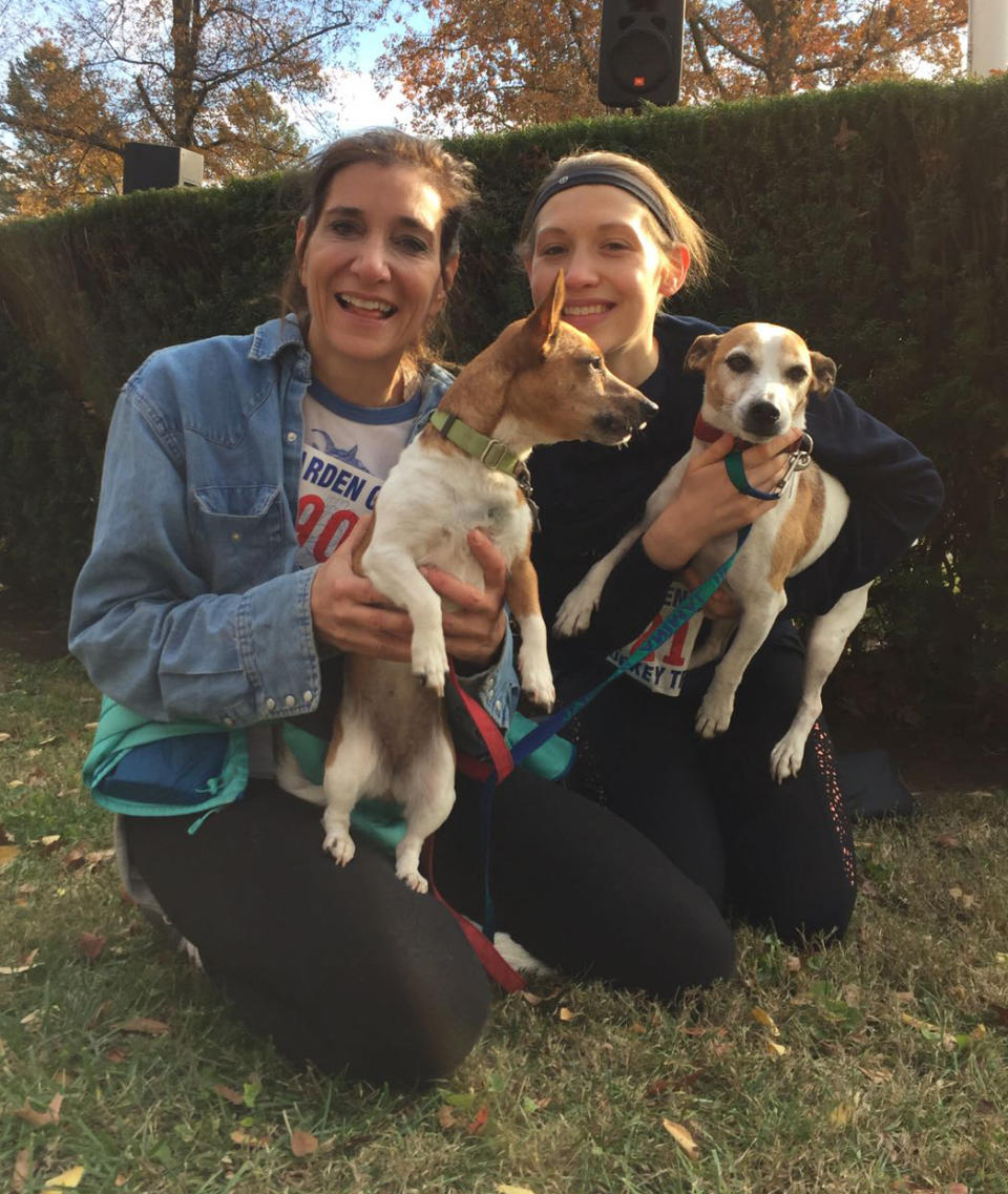 <i>Conte with her two Jack Russel terriers and her daughter</i>