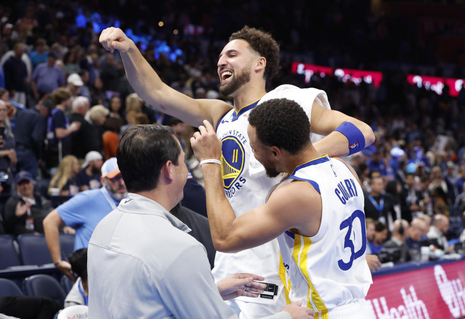 Nov 3, 2023; Oklahoma City, Oklahoma, USA; Golden State Warriors guard Klay Thompson (11) and guard Stephen Curry (30) celebrate after defeating the Oklahoma City Thunder at Paycom Center. Golden State won 141-139. Mandatory Credit: Alonzo Adams-USA TODAY Sports