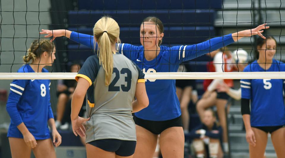 Mia Karl of Ida stares down Anna Schober of Whiteford as Whiteford hosted their first volleyball tournament Wednesday, August 16, 2023 in their new facility. 