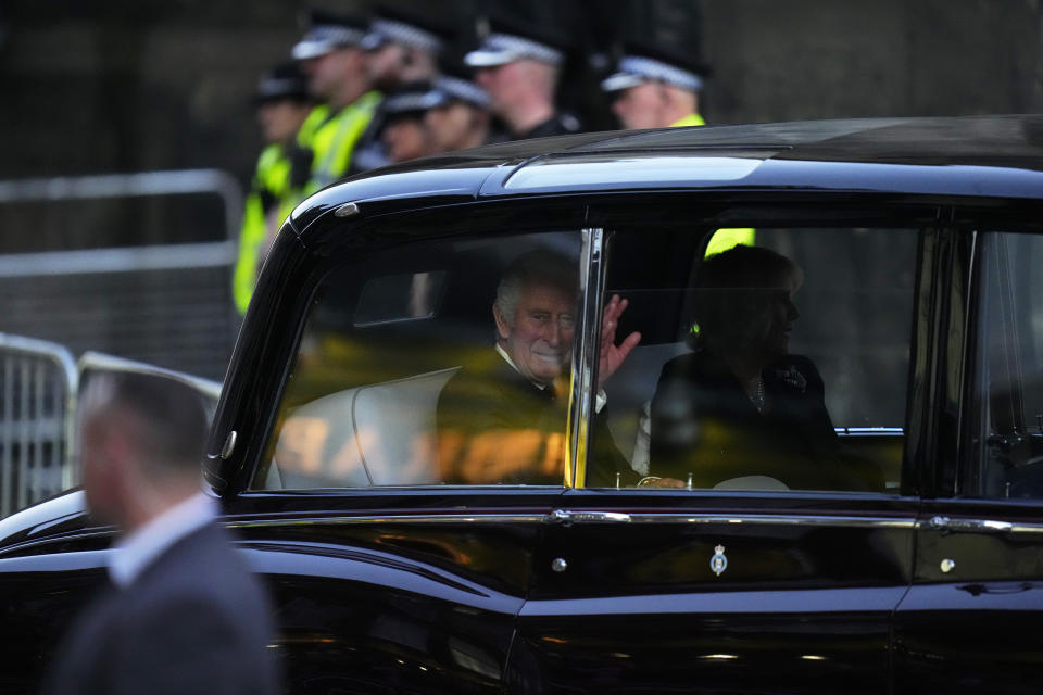 King Charles III and Camilla, the Queen Consort, arrive at St Giles Cathedral where Queen Elizabeth's coffin arrived earlier in the day, in Edinburgh, Scotland, Monday, Sept. 12, 2022. The Queen's children are expected to stage a vigil around the Queen's coffin, known as the Vigil of the Princes, while it lies in there. (AP Photo/Petr David Josek)