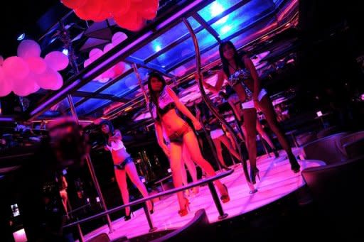 Bangkok's Patpong district is notorious for its raunchy nightlife, where dozens of transgender prostitutes flit among the sprawl of sex shows, pick-up bars and massage parlours