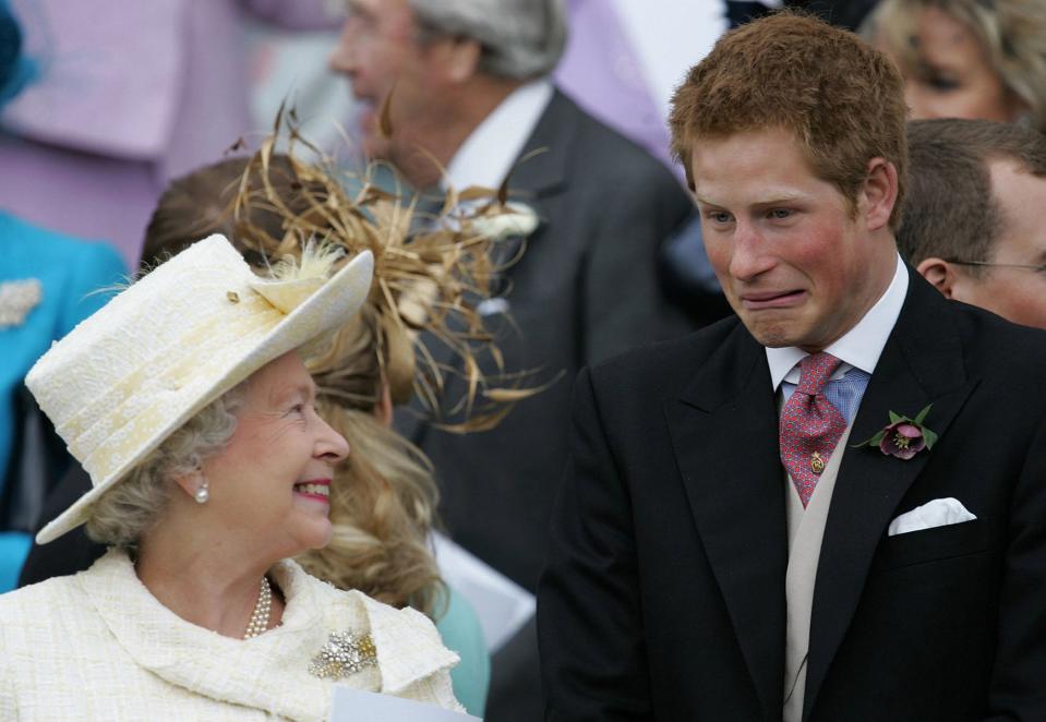 Queen Elizabeth II and Prince Harry share a joke as they watch Prince Charles and his bride Camilla Duchess of Cornwall leave St George's Chapel in Windsor following their marriage blessing in 2005 (AFP/Getty Images)