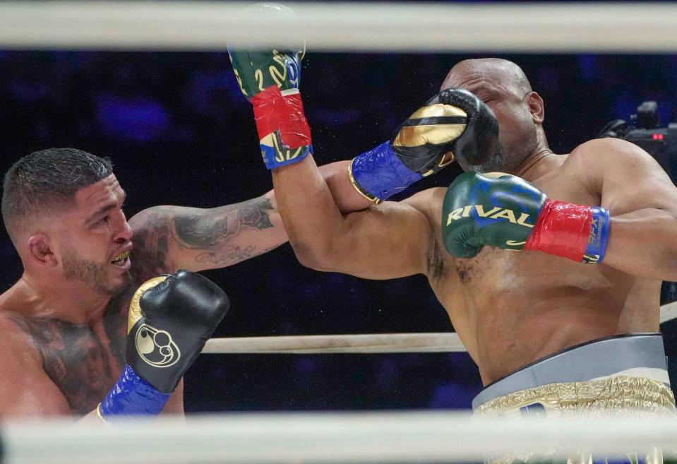 Anthony Pettis, left, trades punches with Roy Jones Jr. in the main event of the 13-fight card Saturday night at Fiserv Forum.