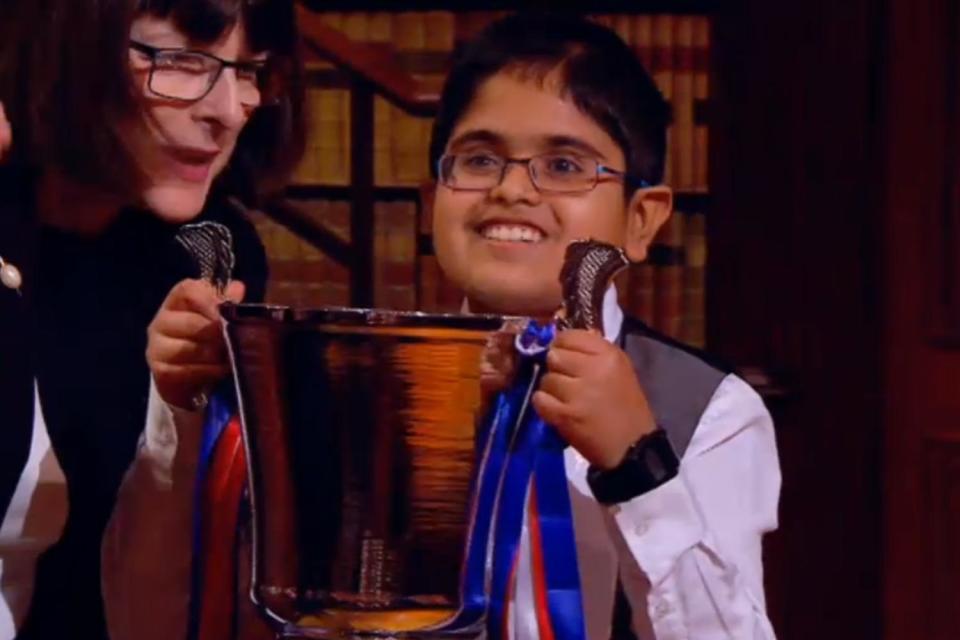 Rahul, from Barnet, receives his trophy: Child Genius