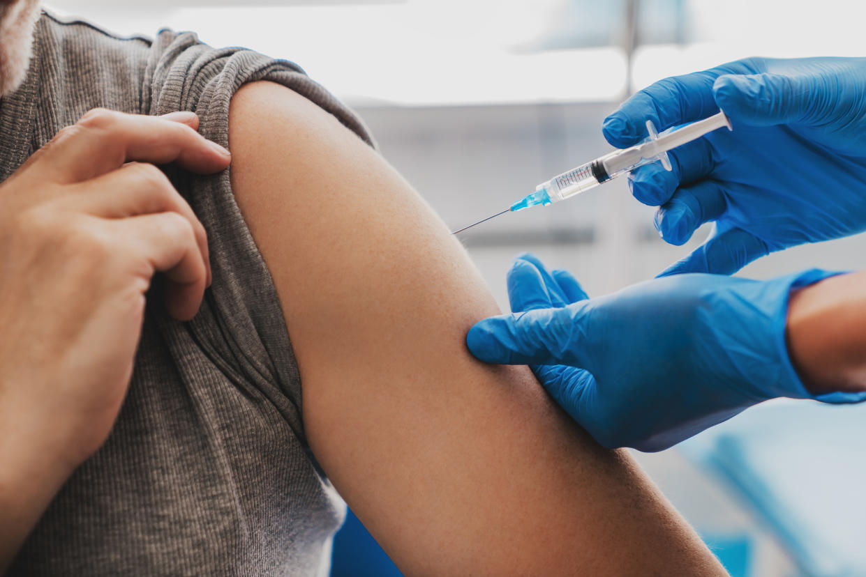 Senior person in hospital getting a flu shot