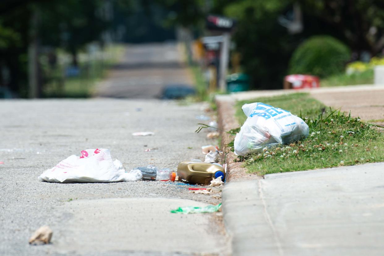 Garbage lays strewn about on Maple Street, Jackson, Tenn. on Wednesday, Jun. 7, 2023.