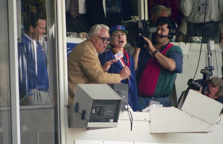 Then first lady Hillary Clinton and the late Chicago Cubs announcer Harry Caray sing 