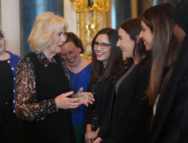 <p>Yui Mok-WPA Pool/Getty</p> Queen Camilla speaks with Changemakers from SafeLives at Buckingham Palace on April 16, 2024.