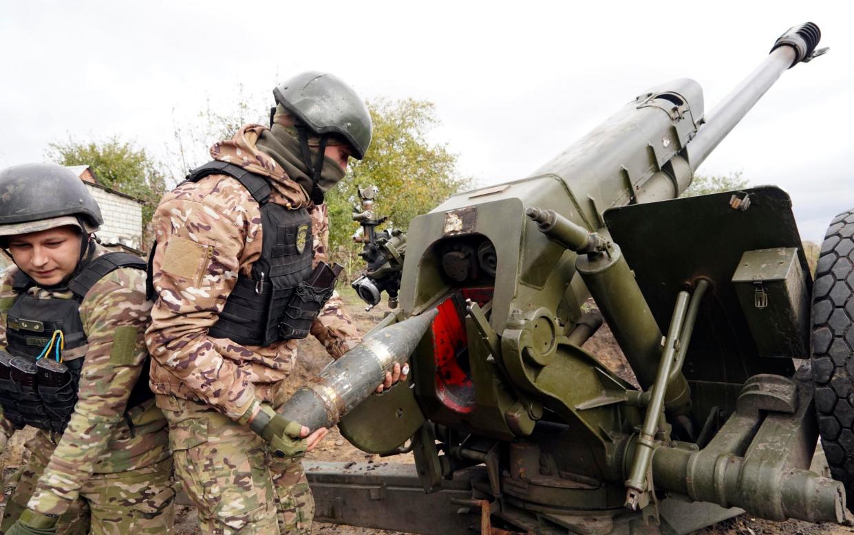 Ukrainian soldiers fire on the front line in the Kharkiv region - AP