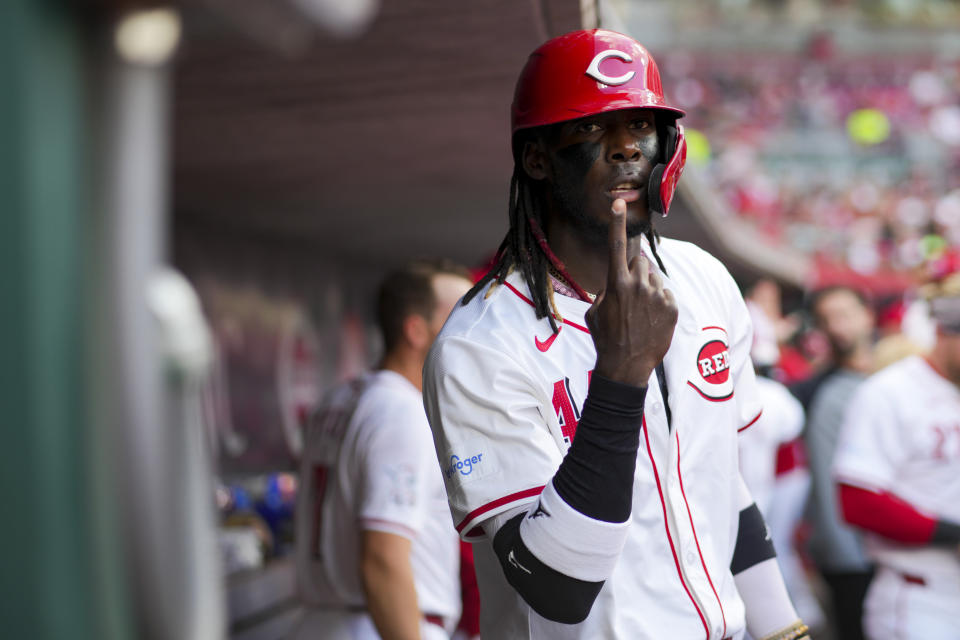 Cincinnati Reds' Elly De La Cruz gestures as he poses for a photo after scoring a run during the second inning of a baseball game against the Milwaukee Brewers in Cincinnati, Monday, April 8, 2024. (AP Photo/Aaron Doster)