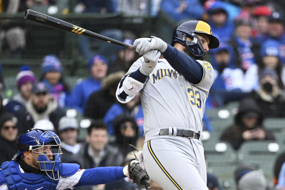 Milwaukee Brewers' Jesse Winker (33) his a RBI single during the eighth inning of a baseball game against the Chicago Cubs, Saturday, April 1, 2023, in Chicago. (AP Photo/Quinn Harris)
