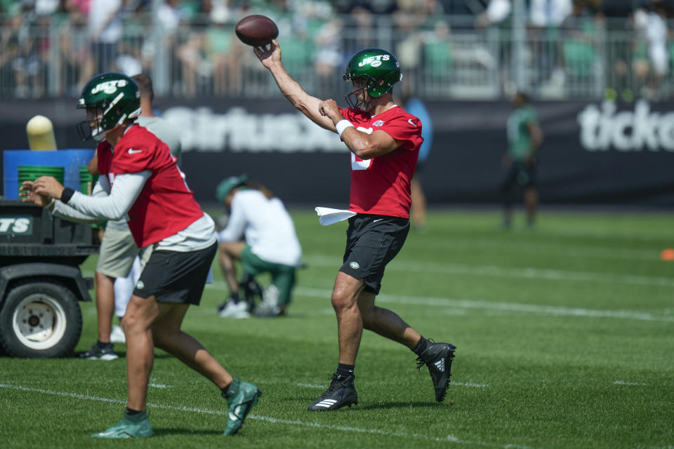 New York Jets quarterback Aaron Rodgers, right, participates in a drill at the NFL football team's training facility in Florham Park, N.J., Sunday, July 23, 2023. (AP Photo/Seth Wenig)