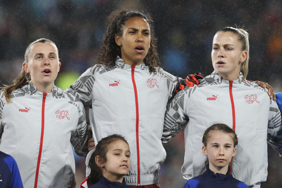 Switzerland's Coumba Sow, centre, sings national anthem ahead of the Women's World Cup Group A soccer match between Switzerland and Norway in Hamilton, New Zealand, Tuesday, July 25, 2023. (AP Photo/Juan Mendez)