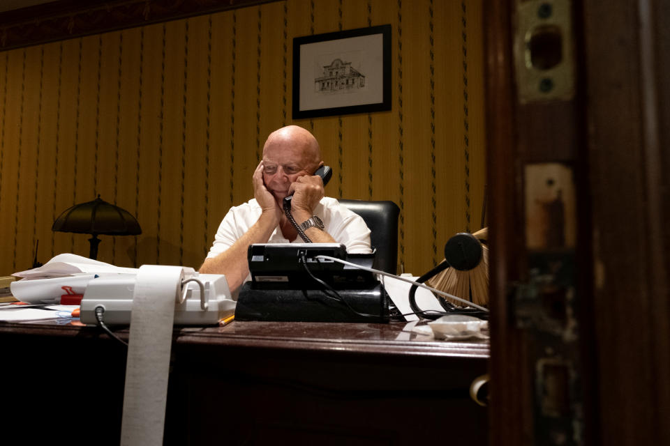 Mark Martin speaks on the phone inside the Brookville Hotel, closed permanently due to the coronavirus disease (COVID-19) pandemic, in Abilene, Kansas, U.S. October 10, 2020. Picture taken October 10, 2020.  REUTERS/Arin Yoon