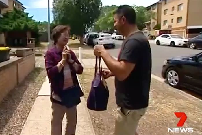 Sydney widow En Huynh is greeted by the man who found and returned her handbag carrying $6000 cash. Source: 7 News