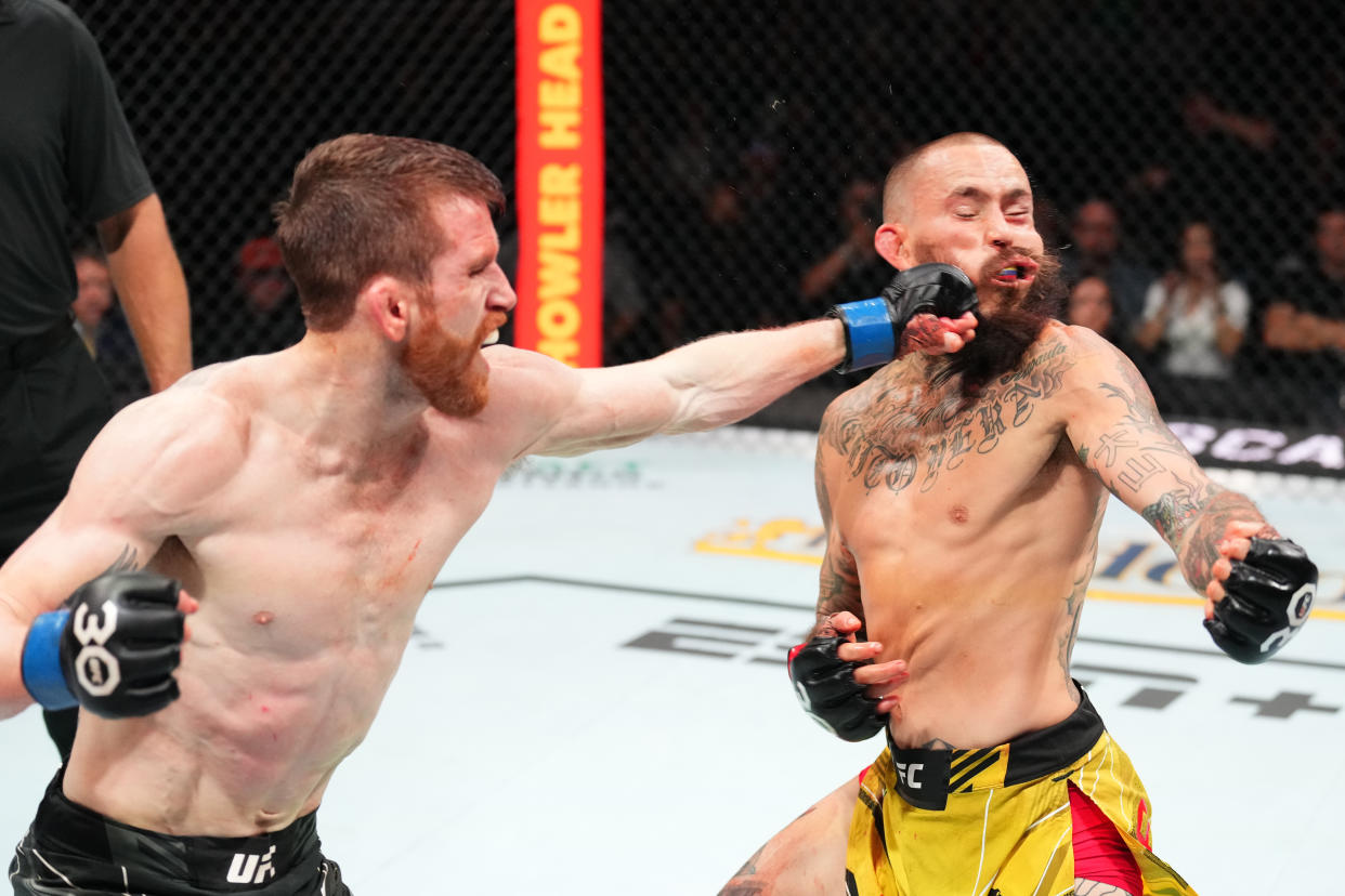 SAN ANTONIO, TEXAS - MARCH 25: (L-R) Cory Sandhagen punches Marlon Vera of Ecuador in a bantamweight fight during the UFC Fight Night event at AT&T Center on March 25, 2023 in San Antonio, Texas. (Photo by Josh Hedges/Zuffa LLC via Getty Images)