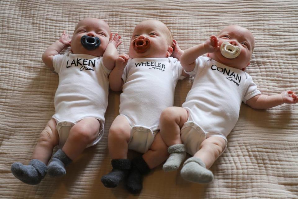 The Mosteller triplets, photographed on May 7 at the family’s home in Vale.