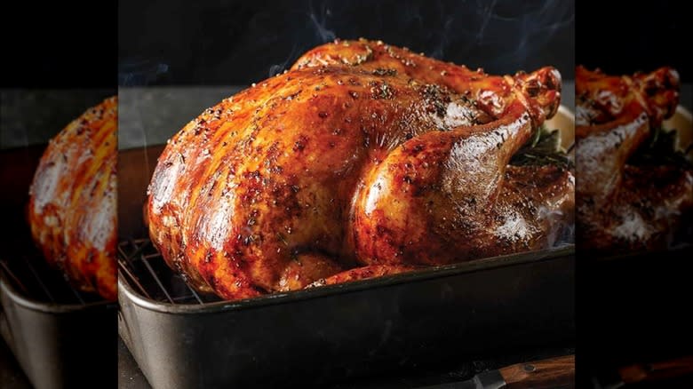 Whole roast turkey in dish