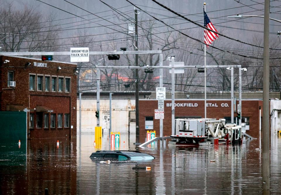 PHOTO: A car and a fire truck are submerged in flood water on Lamont Street after a large rainstorm, Dec. 18, 2023, in Elmsford, N.Y. (Kena Betancur/Getty Images)