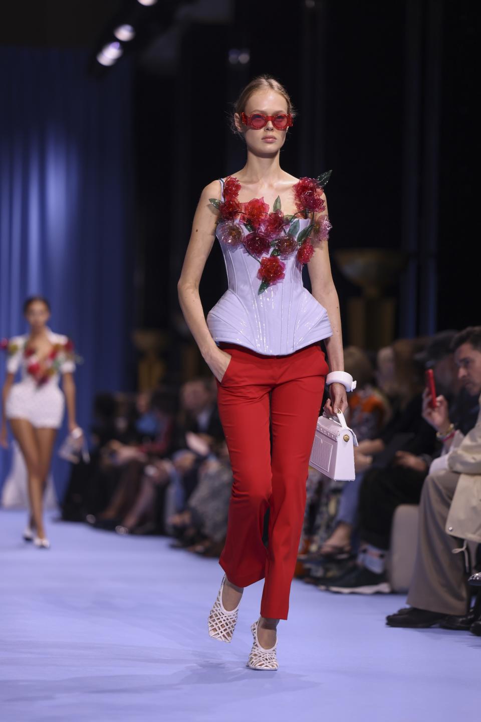 A model wears a creation for the Balmain Spring/Summer 2024 womenswear fashion collection presented Wednesday, Sept. 27, 2023 in Paris. (AP Photo/Vianney Le Caer)