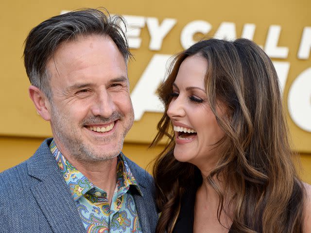 Gregg DeGuire/FilmMagic David Arquette and his wife Christina McLarty Arquette attend the Los Angeles premiere of 'They Call Me Magic' on April 14, 2022 in Los Angeles, California