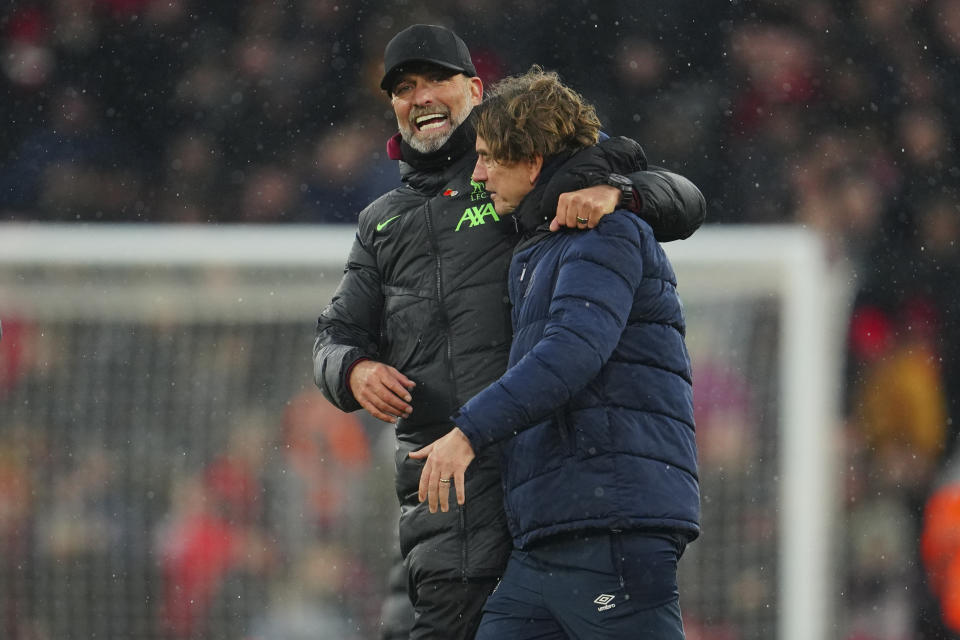 Liverpool's manager Jurgen Klopp, left, embraces Brentford's head coach Thomas Frank at the end of the English Premier League soccer match between Liverpool and Brentford at Anfield stadium in Liverpool, England, Sunday, Nov. 12, 2023. (AP Photo/Jon Super)