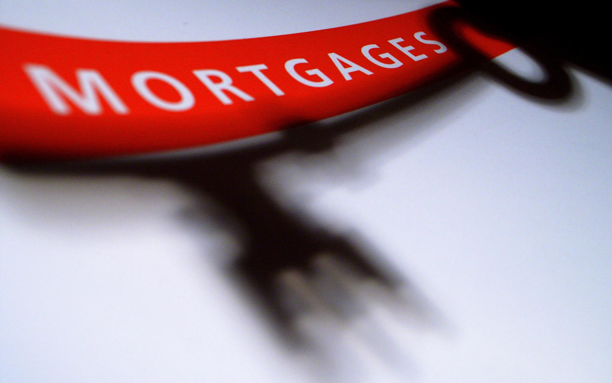 GLASGOW - DECEMBER 06: In this photo illustration of a mortgage application form, the shadow of a house key held by a woman, falls over the form on December 6, 2007 in Glasgow, Scotland.The British economy is beginning to feel the effects of the credit crisis which began this year. House prices have begun to fall and the retail sector is predicting a difficult Christmas period.  (Photo by Jeff J Mitchell/Getty Images)