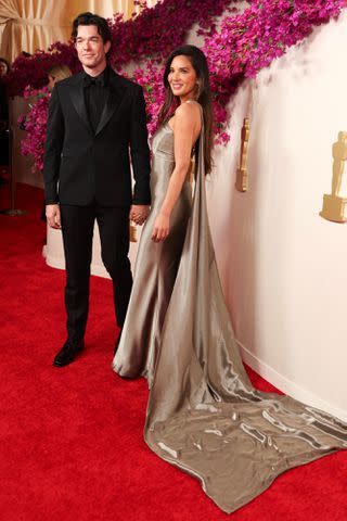 <p>DAVID SWANSON/AFP via Getty</p> Olivia Munn poses alongside boyfriend John Mulaney at the 2024 Oscars.