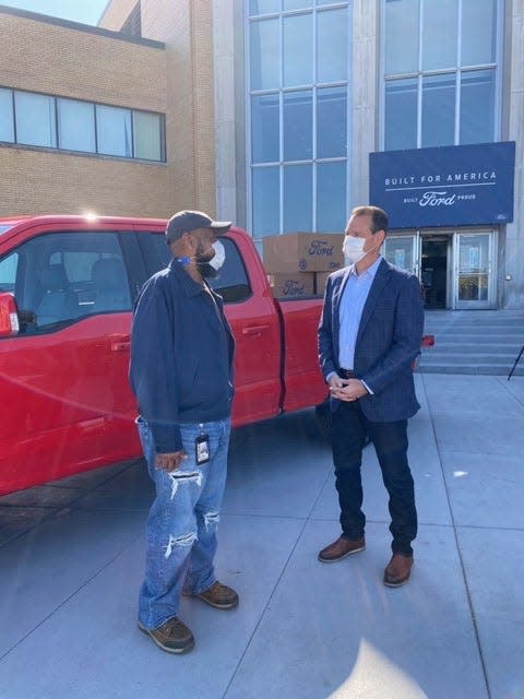 Ronald Green, left, is a 43-year Kansas City Assembly Plant worker who talked with John Savona, Ford North America Manufacturing vice president on Tuesday, October 6, 2020 after a company celebration. They're standing in front of a 2021 F-150 pre-production prototype.