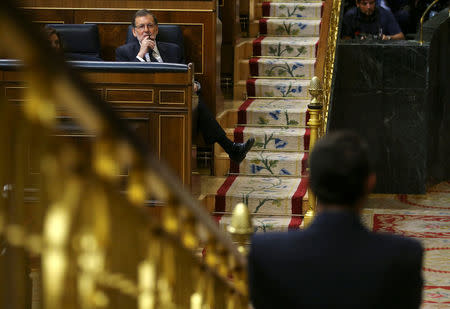 Spain's acting Prime Minister Mariano Rajoy listens to a speech during the investiture debate at the Parliament in Madrid, Spain, October 27, 2016. REUTERS/Andrea Comas