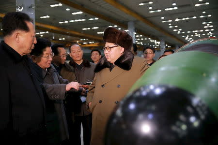North Korean leader Kim Jong Un meets scientists and technicians in the field of researches into nuclear weapons in this undated photo released by North Korea's Korean Central News Agency (KCNA) in Pyongyang March 9, 2016. REUTERS/KCNA
