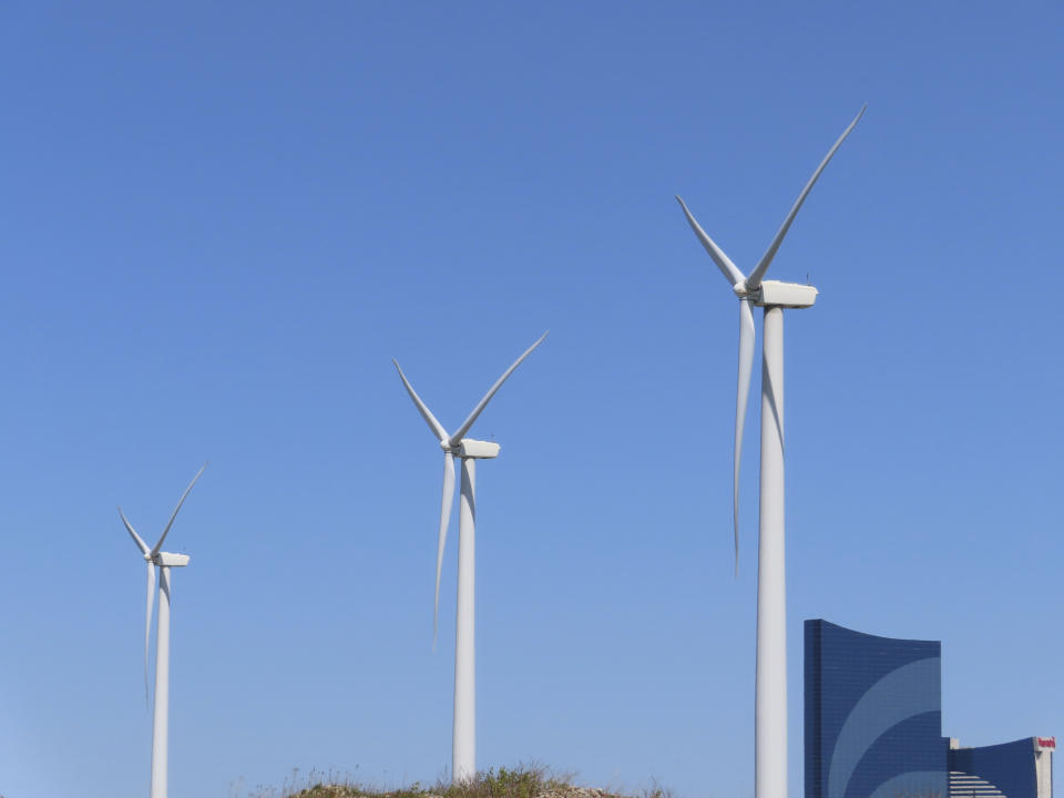 Land-based wind turbines spin in Atlantic City, N.J., on April 28, 2022. On July 11, 2024, Community Offshore Wind identified itself as the third company to submit plans for an offshore wind farm in New Jersey by the previous day's deadline. (AP Photo/Wayne Parry)