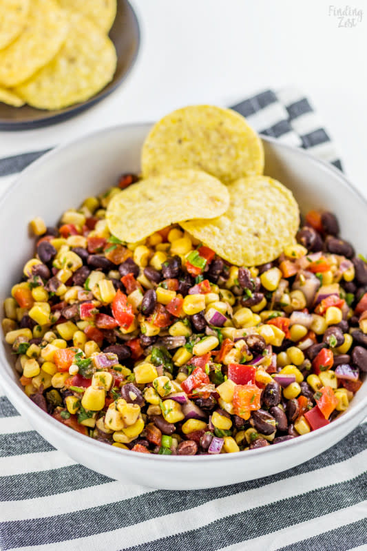 <p>Finding Zest</p><p>Get the recipe: <a href="https://www.findingzest.com/black-bean-corn-salsa/" rel="nofollow noopener" target="_blank" data-ylk="slk:Black Bean Corn Salsa;elm:context_link;itc:0;sec:content-canvas" class="link "><strong>Black Bean Corn Salsa</strong></a></p>