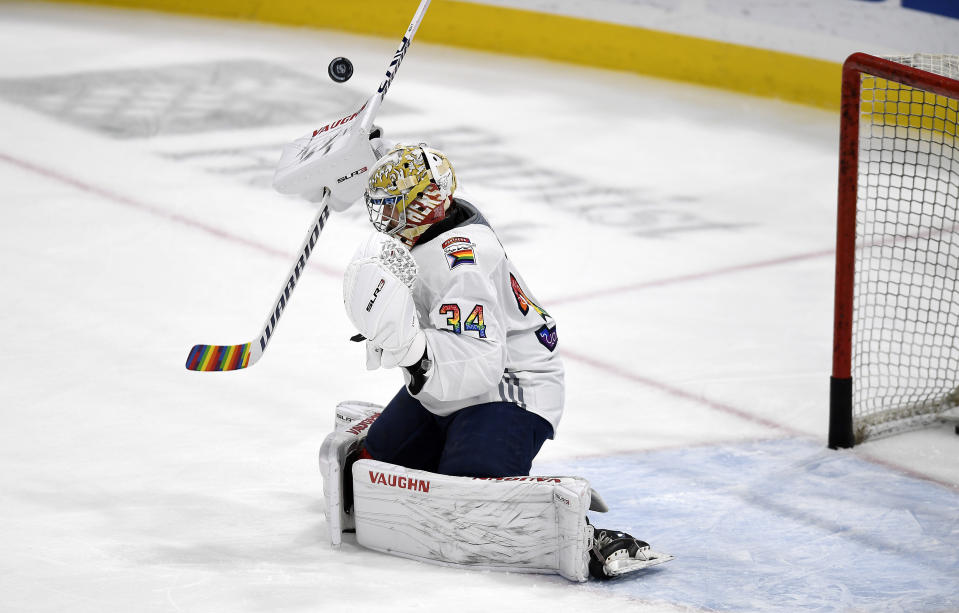 Florida Panthers goaltender Alex Lyon (34) warms up while wearing a Pride Night jersey before playing the Toronto Maple Leafs, Thursday, March 23, 2023, in Sunrise, Fla. (AP Photo/Michael Laughlin)