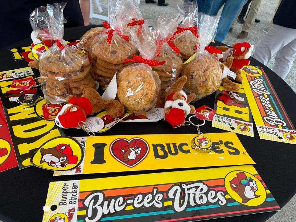 Buc-ee’s swag fills a table at the 2023 groundbreaking for the travel center coming to Harrison County. The huge stores are filled with shelves and aisles to gifts, souvenirs and treats.