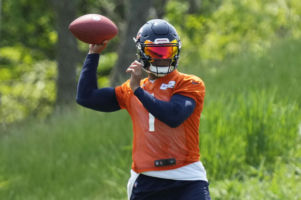 Chicago Bears quarterback Justin Fields works on the field during NFL football OTA practice in Lake Forest, Ill., Tuesday, May 23, 2023. (AP Photo/Nam Y. Huh)