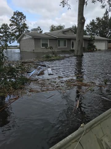 <p>House immersed in water by Doctor's Lake in Clay County </p>