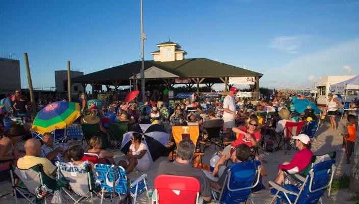 People gather for a Music by the Sea concert in St. Augustine Beach in this file photo.