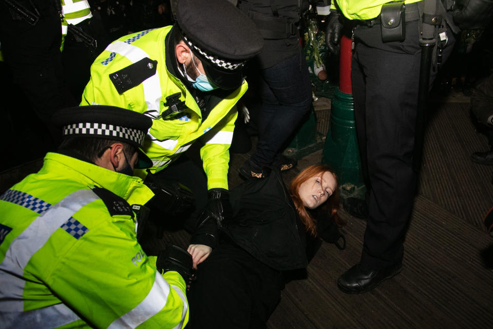 Hundreds of people gathered at a peaceful vigil for Sarah Everard on Clapham Common in South London on the 13th of March 2021, London, United Kingdom. Sarah Everard went missing on 3 March after setting off at 9pm from a friends house to make her two and a half mile journey home. Police making arrests. The vigil was also a call to end violence against girls and women perpetrated by men. The vigil was not sanctioned by police because of Covid restrictions and the police decided to arrest a number of people in an attempt to end the peaceful and highly emotional vigil. The event took place at the band stand on the common and speeches were held from the stand till police confiscated the sound equipment.(photo by Kristian Buus/In Pictures via Getty Images)