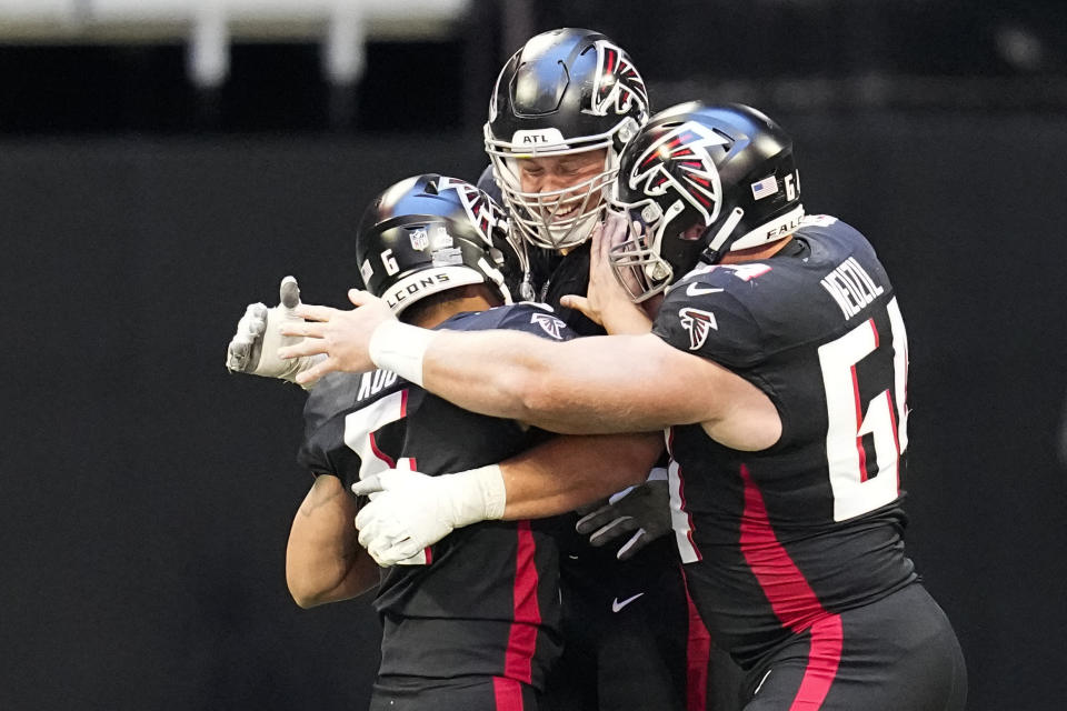 Atlanta Falcons place-kicker Younghoe Koo (6) celebrates with his teammates after kicking the game winning filed goal in the second half of an NFL football game against the Houston Texans in Atlanta, Sunday, Oct. 8, 2023. (AP Photo/Mike Stewart)