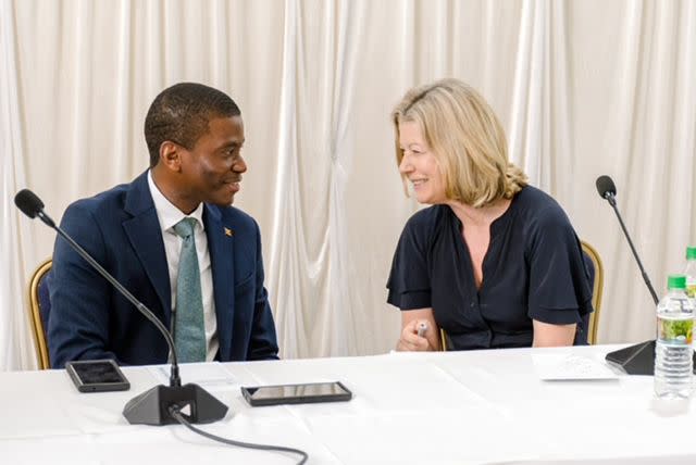 <p>Reynaldo Bernard</p> Laura Trevelyan with Prime Minister of Grenada Dickon Mitchell when she made an apology along with members of her family in February