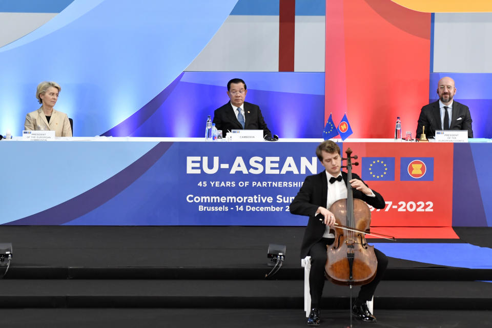 European Commission President Ursula von der Leyen, left, Cambodia's Prime Minister Hun Sen, center, and European Council President Charles Michel listen to a musical performance during the opening ceremony at an EU-ASEAN summit in Brussels, Wednesday, Dec. 14, 2022. EU and ASEAN leaders meet in Brussels for a one day summit to discuss the EU-ASEAN strategic partnership, trade relations and various international topics. (AP Photo/Geert Vanden Wijngaert)