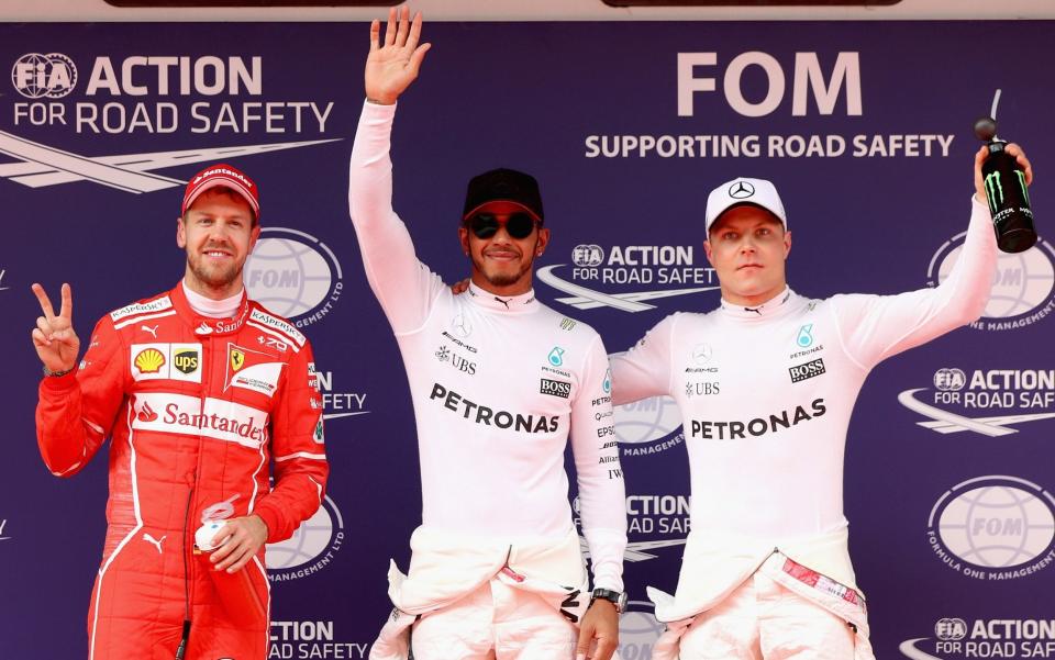 Sebastian Vettel, Lewis Hamilton and Valtteri Bottas - Credit: Getty Images